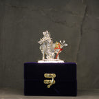 Silver-Finish Krishna with Cow Idol – Boxed — Silver tone on a deep blue velvet base