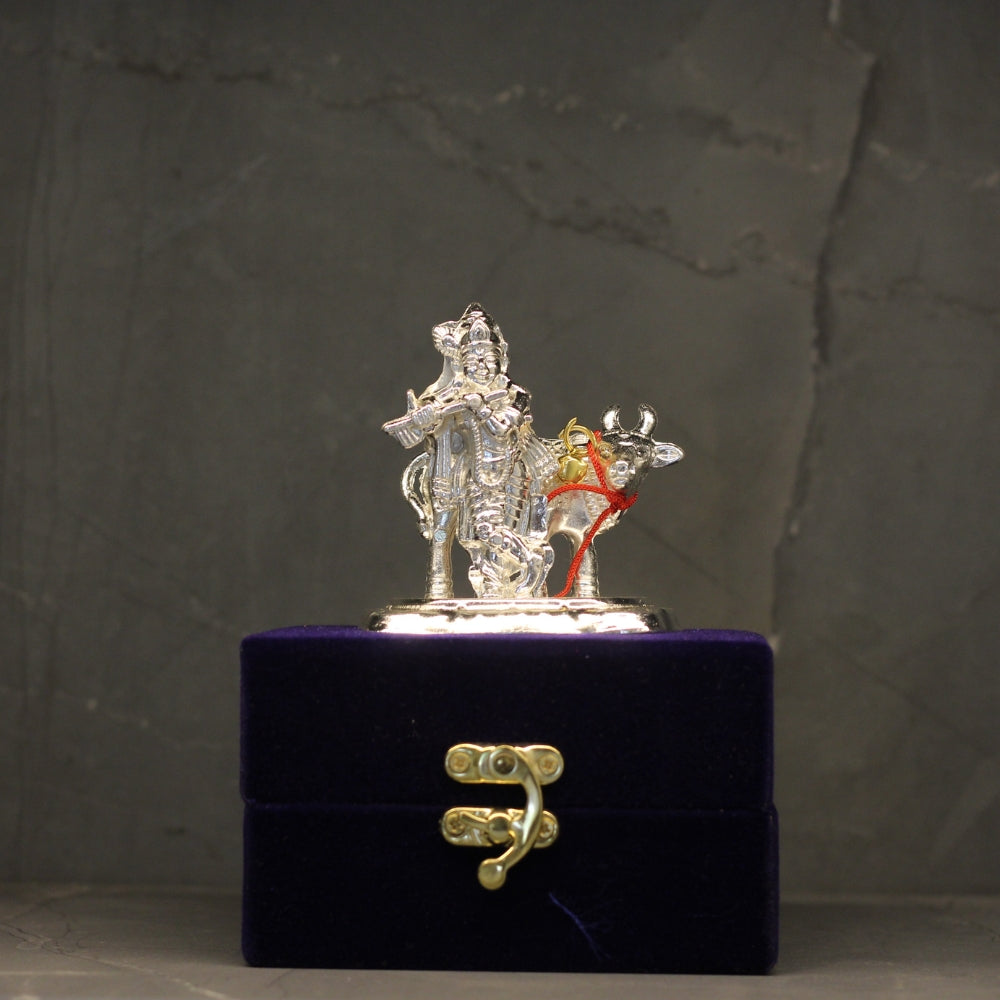 Silver-Finish Krishna with Cow Idol – Boxed — Silver tone on a deep blue velvet base