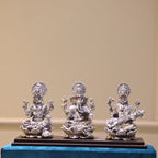 Laxmi Ganesh Saraswati Idol Set – Silver Finish, Boxed — Silver tone on a blue velvet base