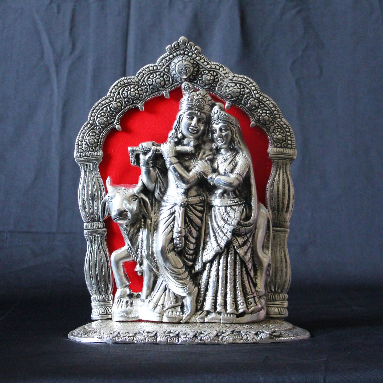 Radha Krishna Temple Arch Idol – 11.5 inch — Silver tone with a red fabric backing
