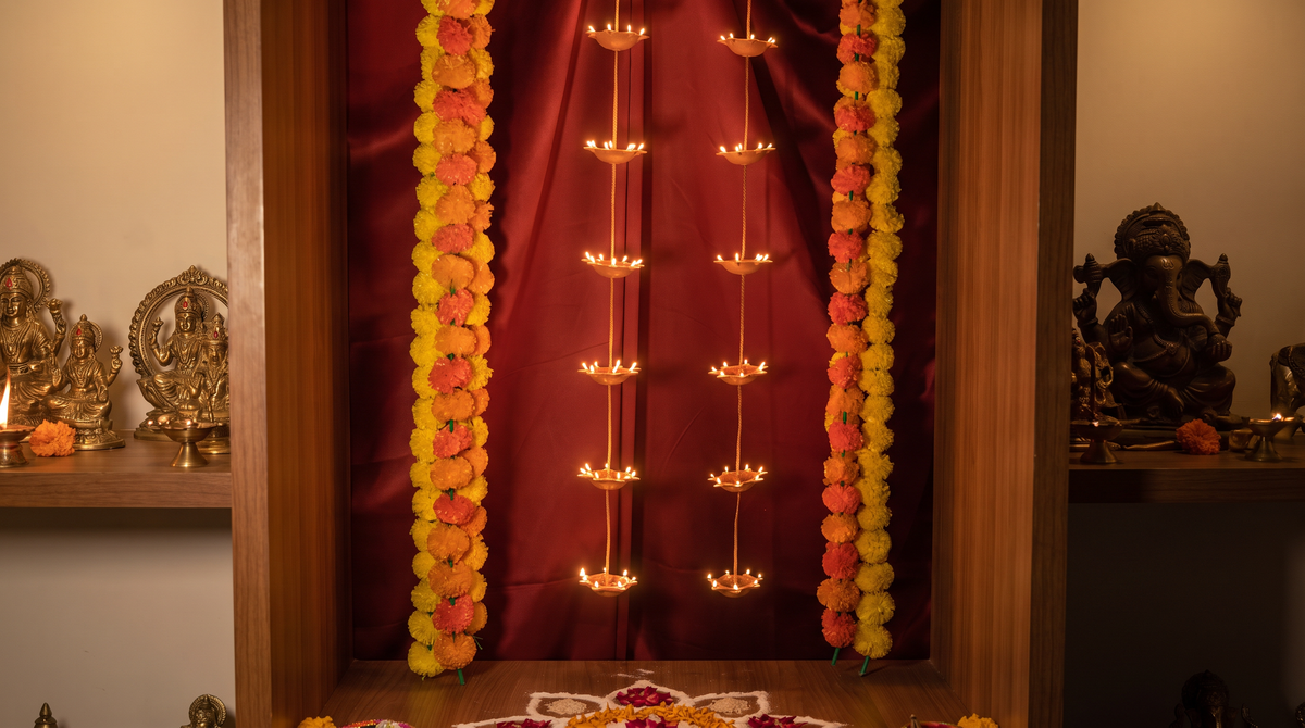 Ganpati wider mandir styling of the Pair of 7 Vertical Diyas, editorial campaign shot