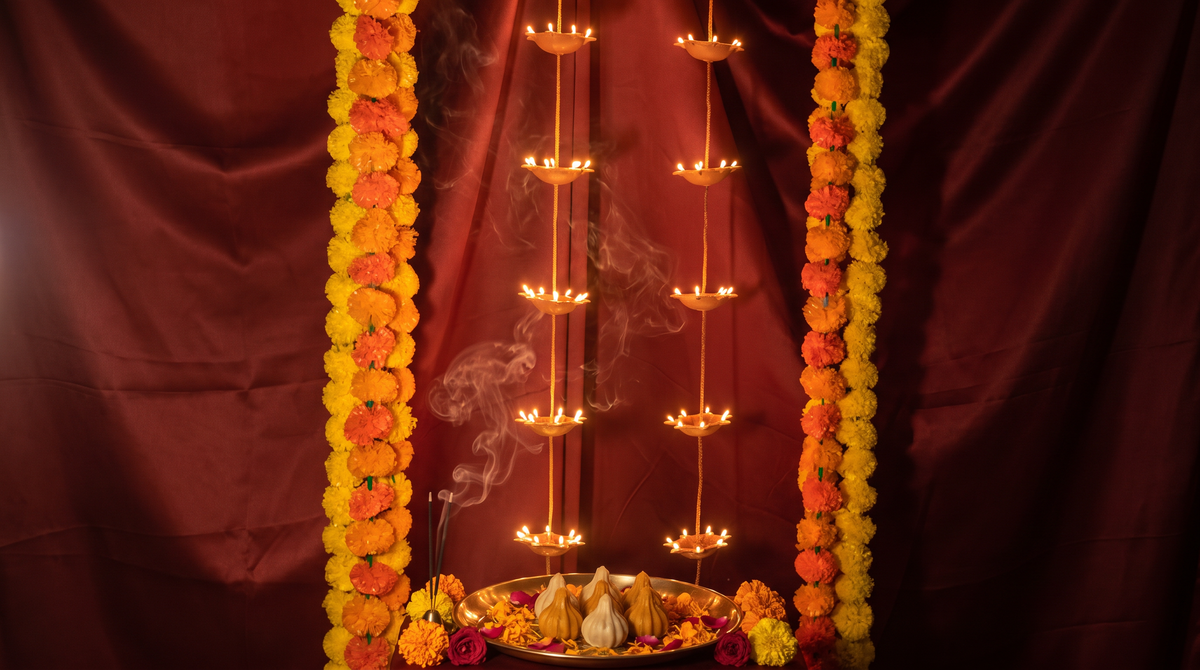 Ganpati intimate mandir styling featuring the Pair of 7 Vertical Diyas, editorial campaign shot