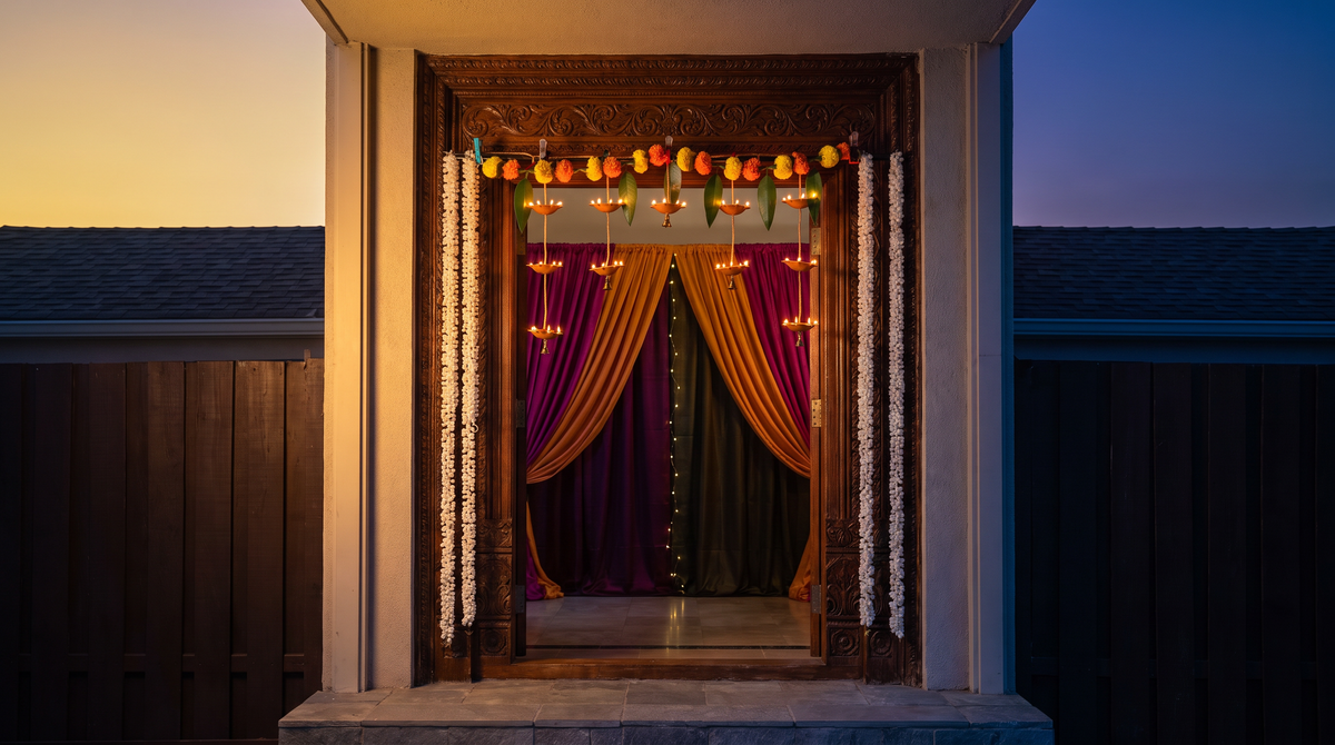 Navratri festive entrance styling featuring the 11-Diya Door Toran, editorial campaign shot
