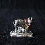 Silver-Finish Cow and Calf Idol – Small — Antique silver tone with a red cord detail