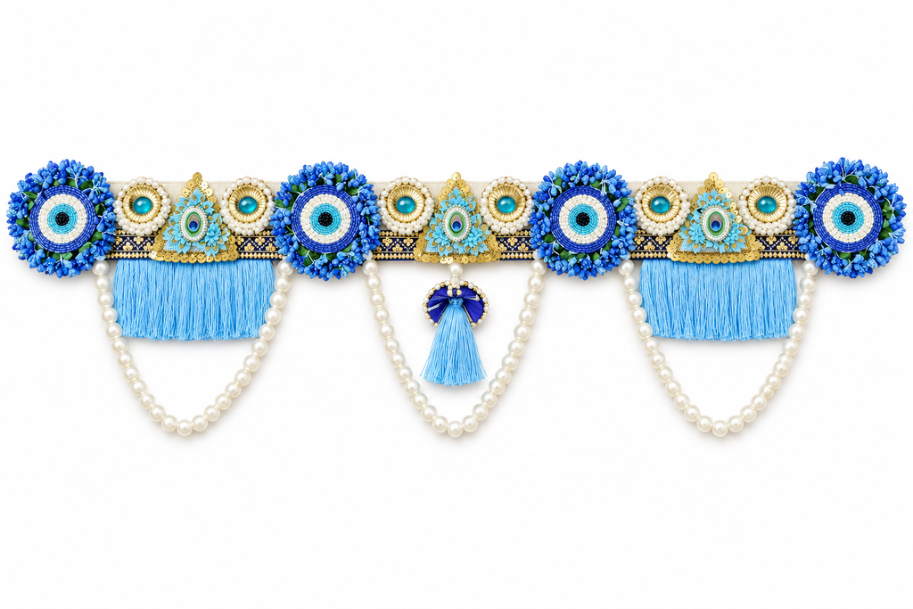 Blue floral beadwork toran with pearl swags on white
