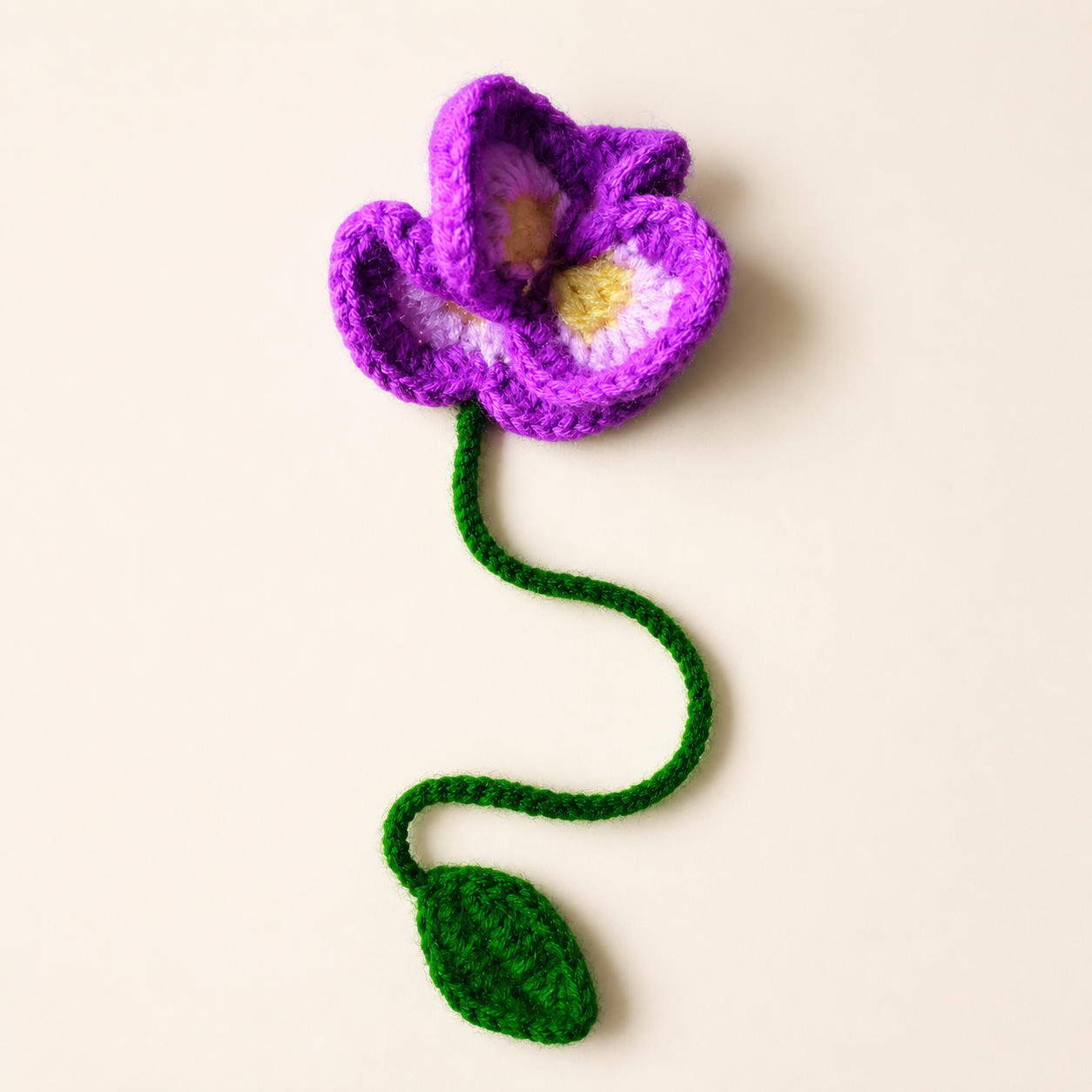 Purple Orchid handmade crochet flower bookmark, studio photo