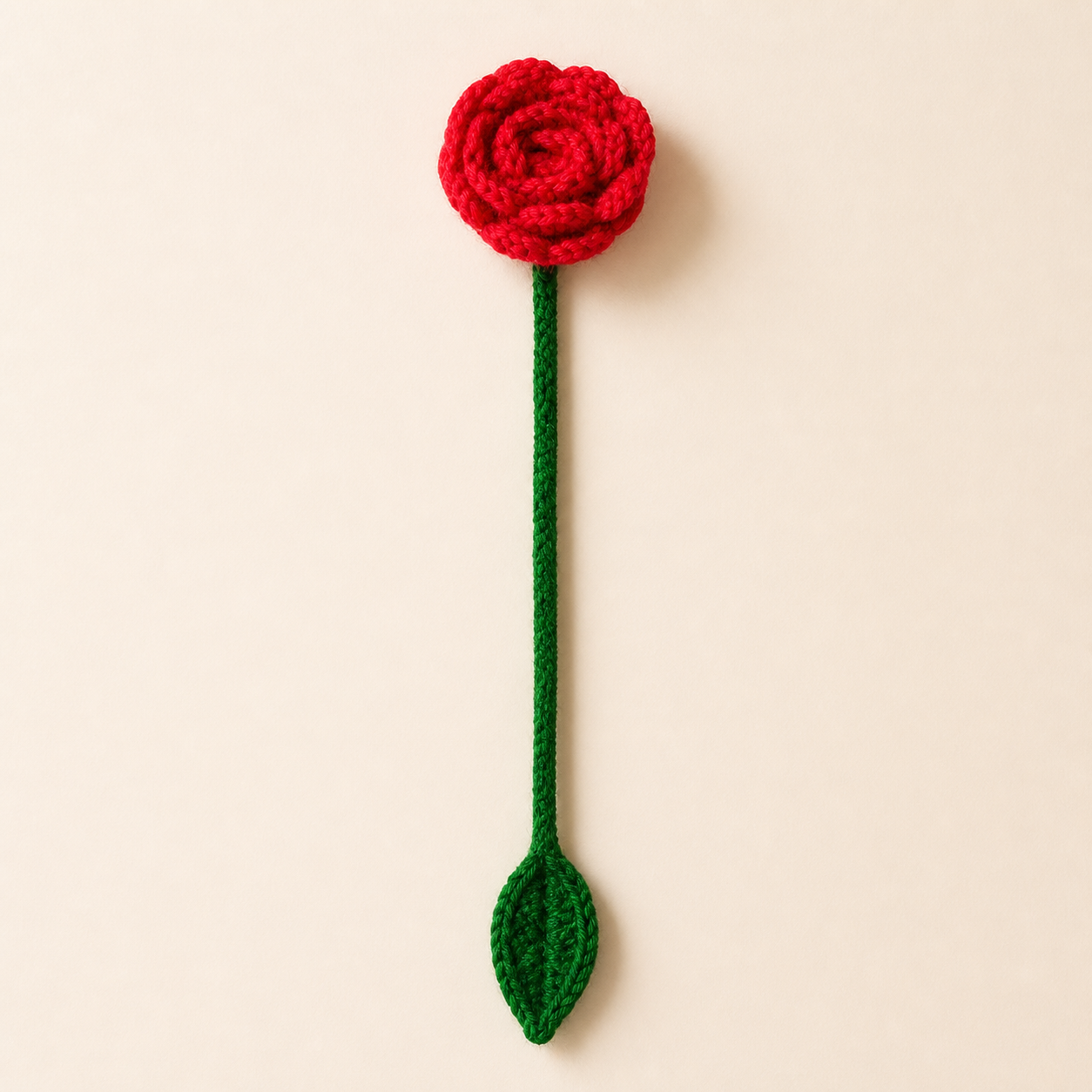 Red Rose handmade crochet flower bookmark, studio photo