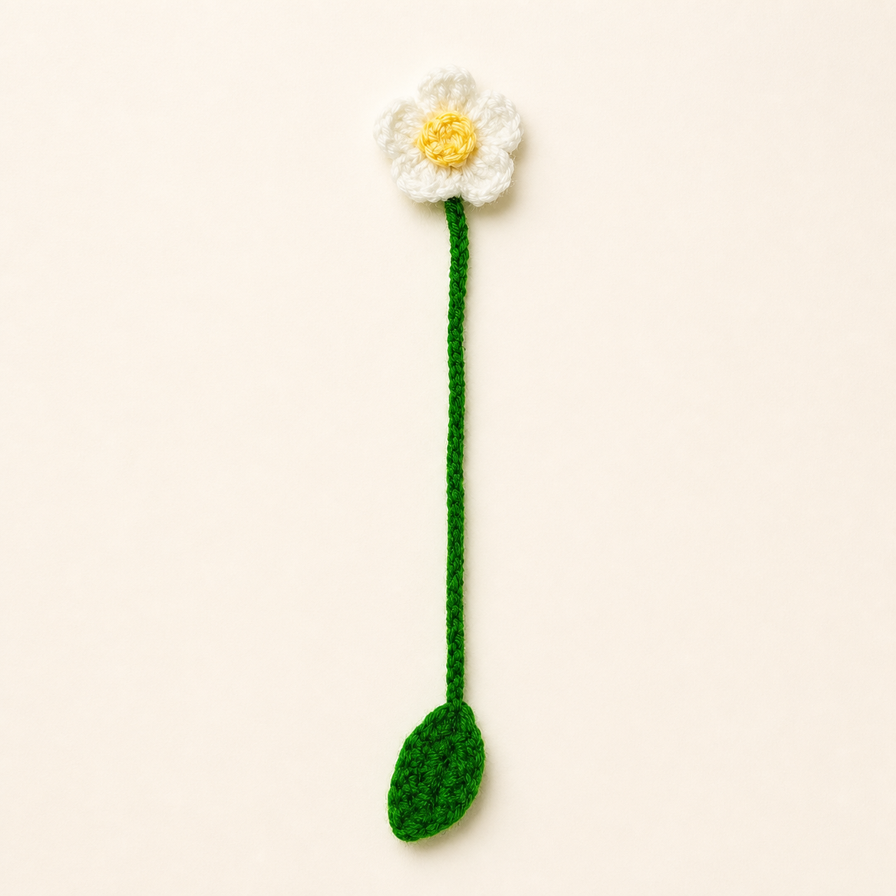 Small White Blossom handmade crochet flower bookmark, studio photo