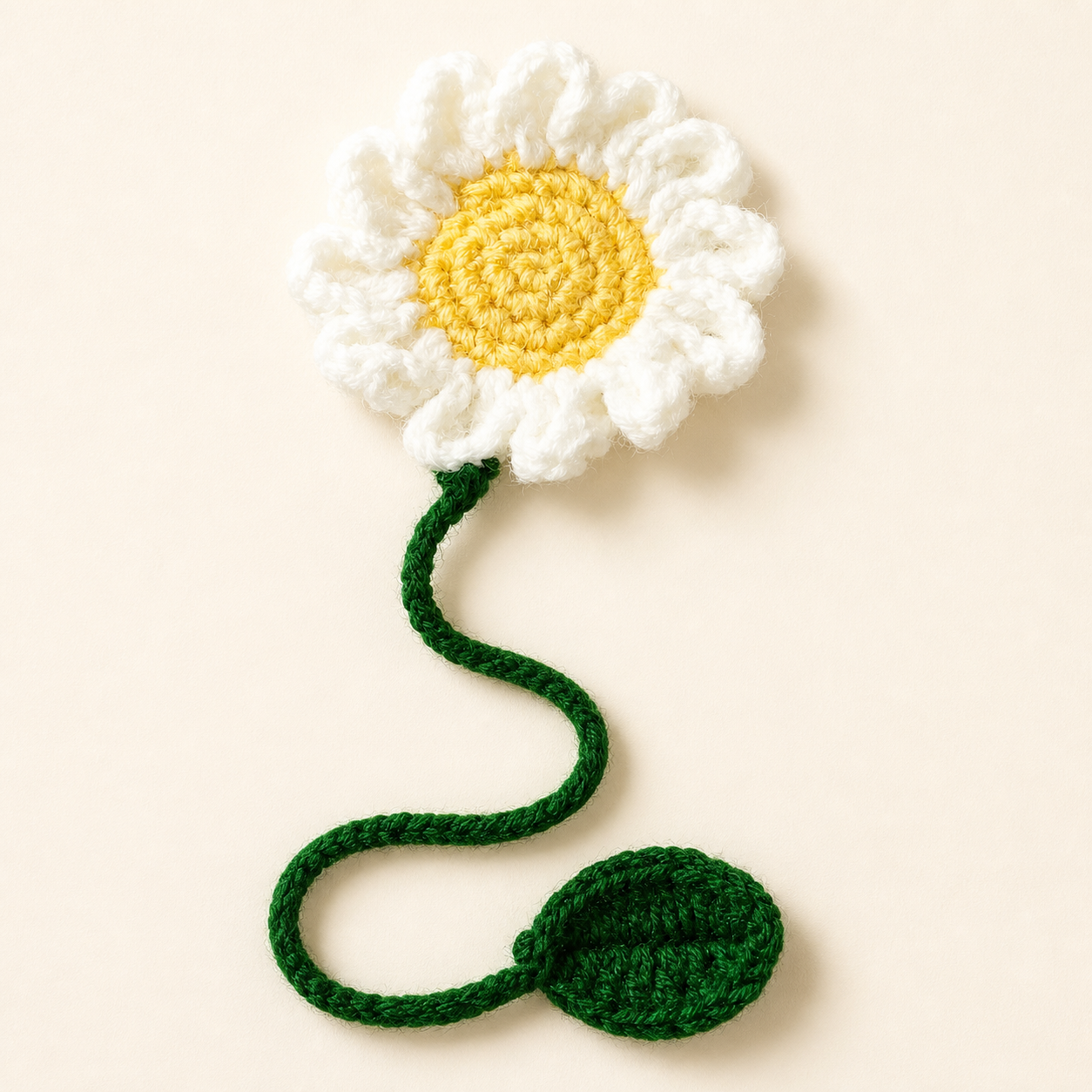 White Daisy handmade crochet flower bookmark, studio photo