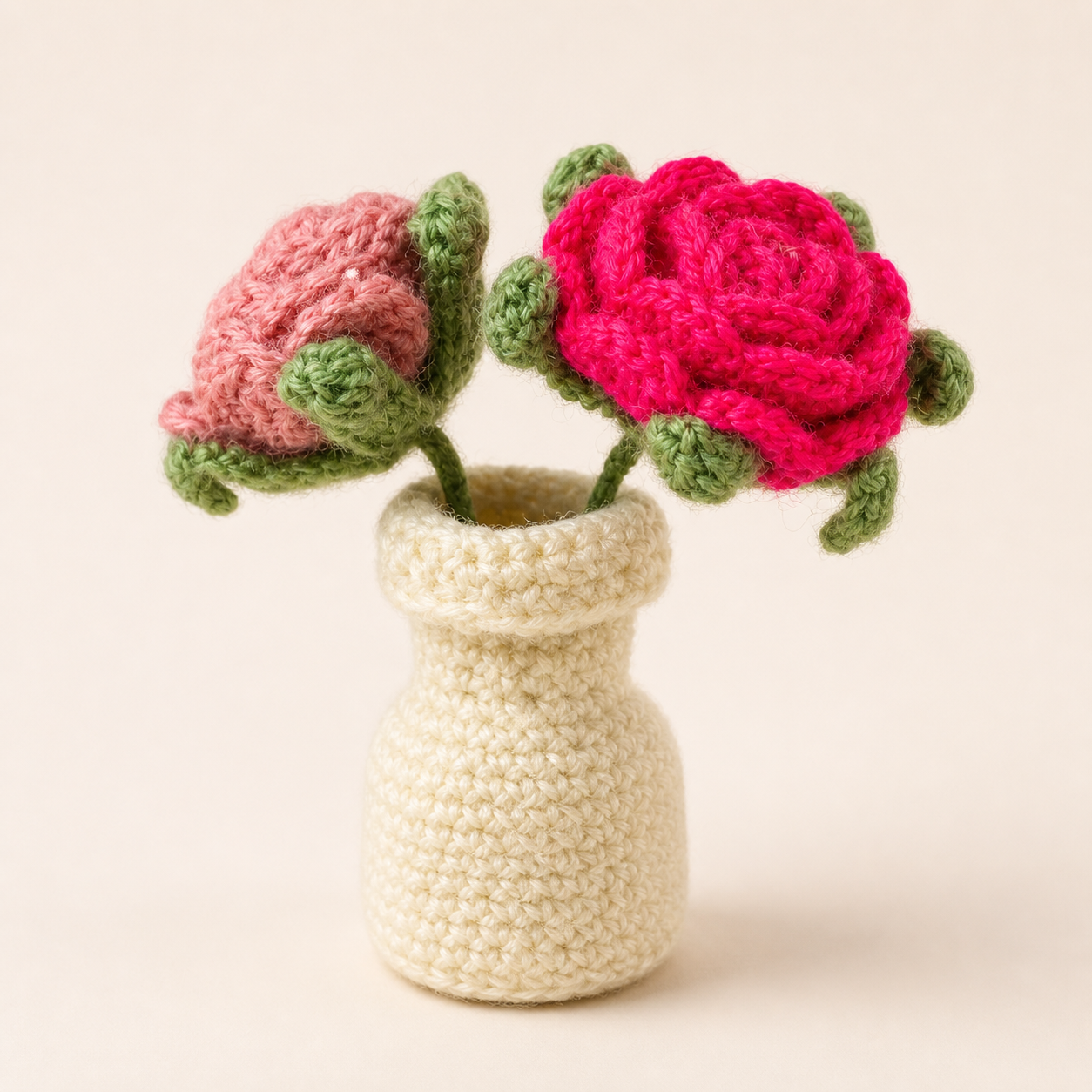 Handcrafted crochet cream vase with pink and fuchsia rose flowers