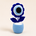 Handmade blue crochet evil eye flower in a light blue pot