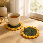 Crochet sunflower coaster set displayed with a tea cup on a wooden table