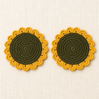 Top view of two crochet sunflower coasters