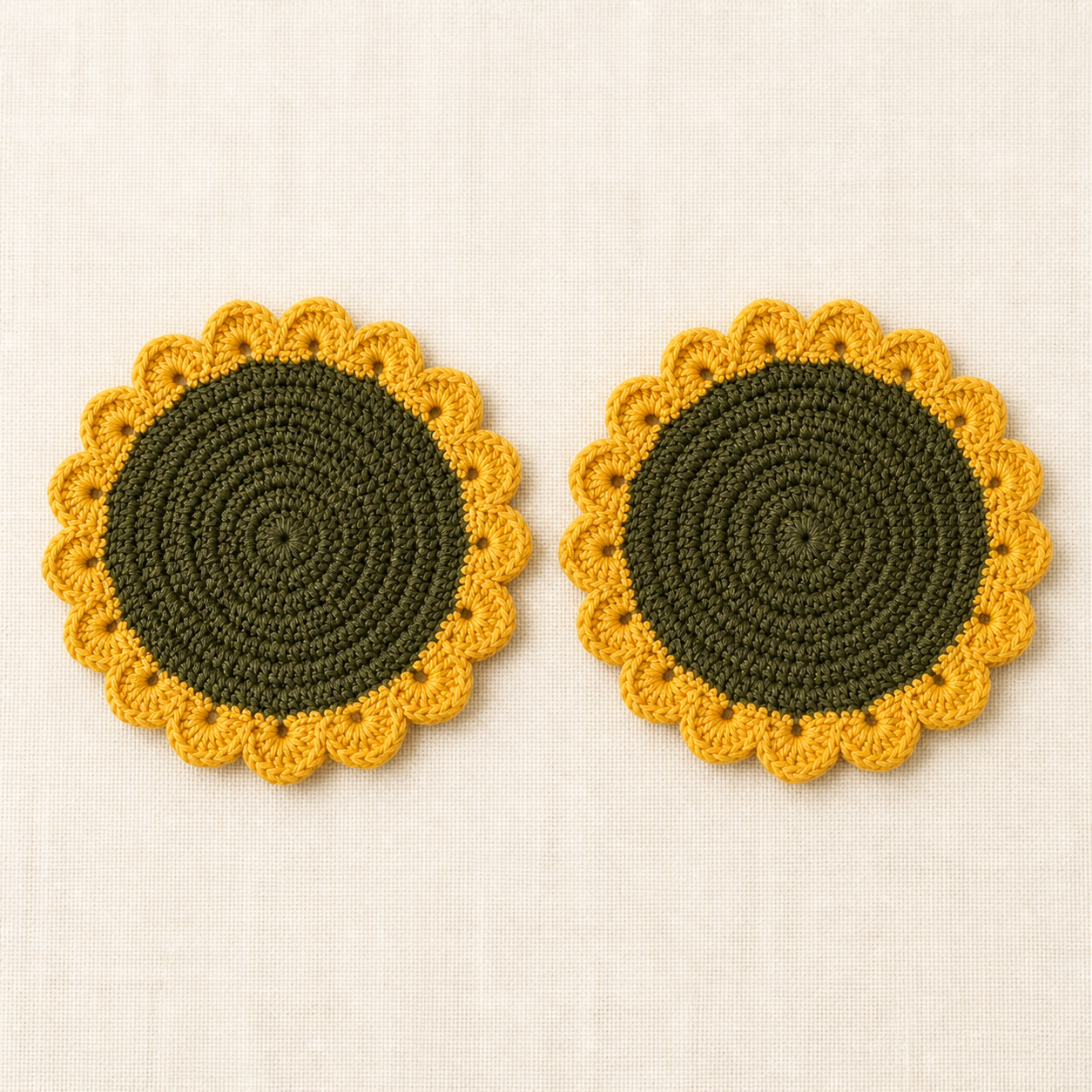 Top view of two crochet sunflower coasters