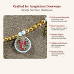 Ganesha Pearl Toran features – pink enamel Ganesha, pearl frame, golden filigree, leaf charms