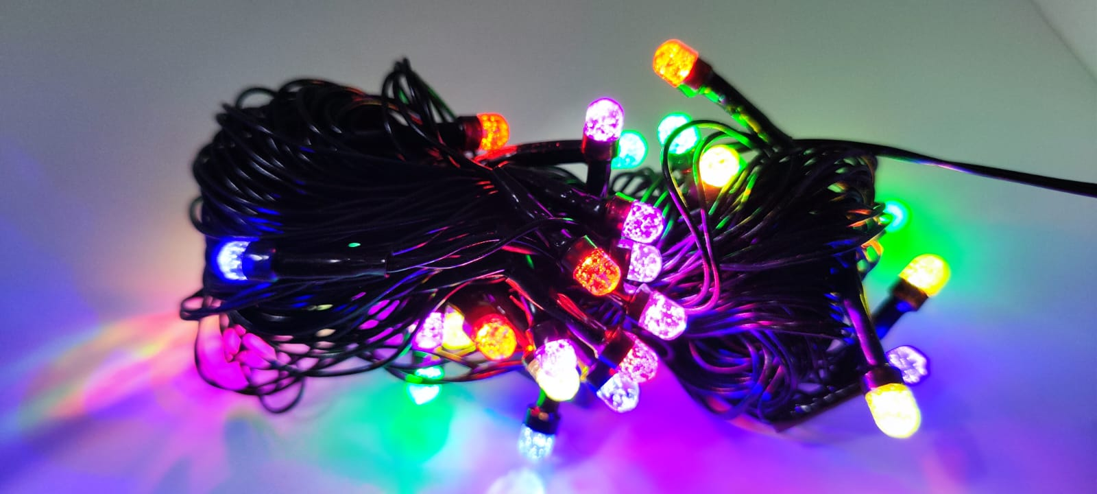 Multicolour Gel LED Ball Lights coiled bundle, lit