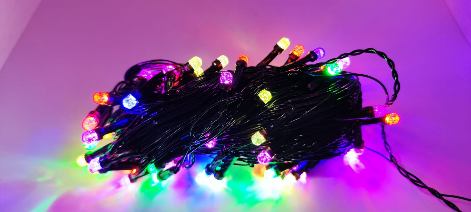 Multicolour Gel LED Ball Lights bundle on purple background, lit