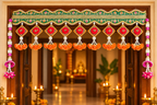 Green embroidered toran with orange rose drops at a festive entrance
