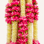 Close-up of pink and cream artificial flowers with green accents