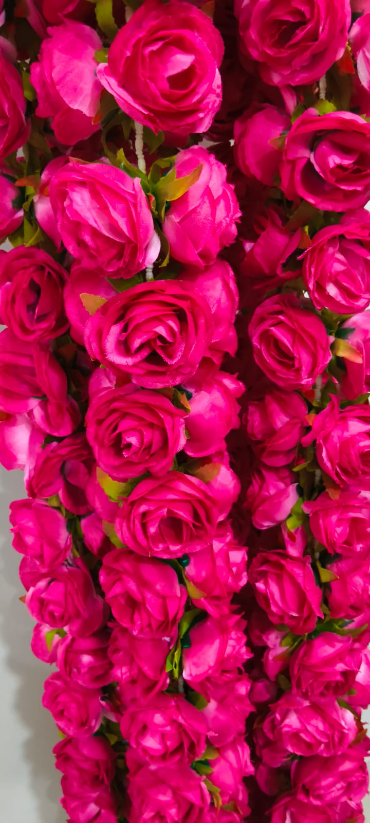 Original close-up of rose red artificial rose blooms