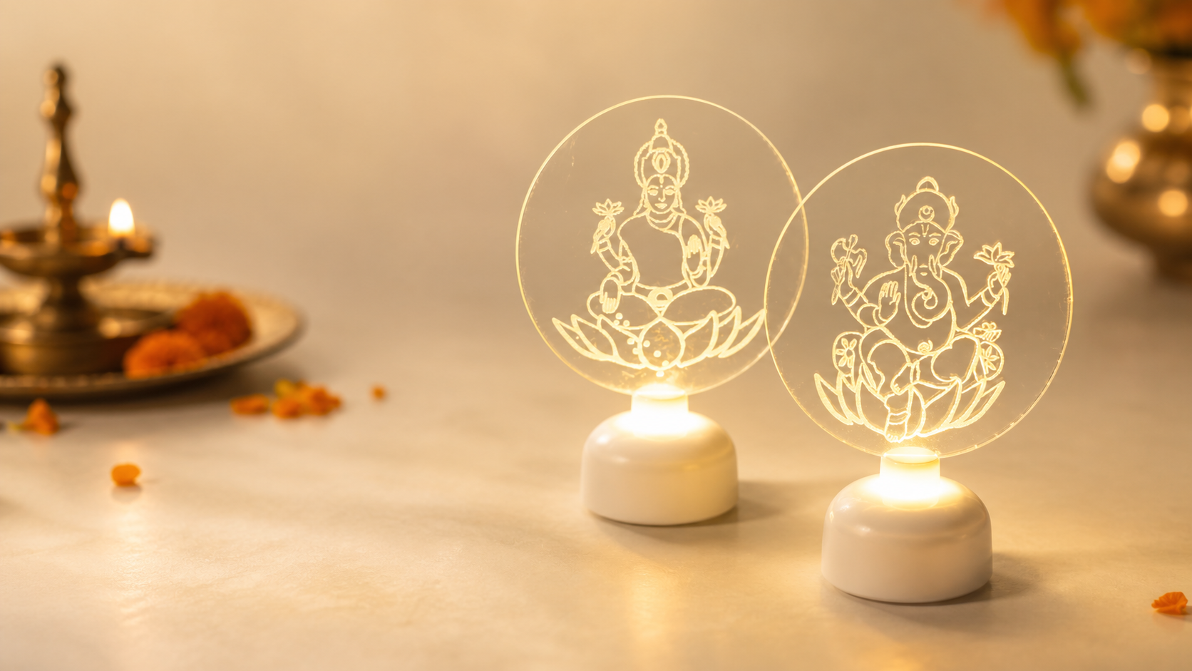 Pair of illuminated acrylic devotional lamps featuring Goddess Lakshmi and Lord Ganesha