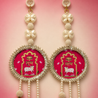 Close-up of butterfly pearl work and Shubh Labh plaques