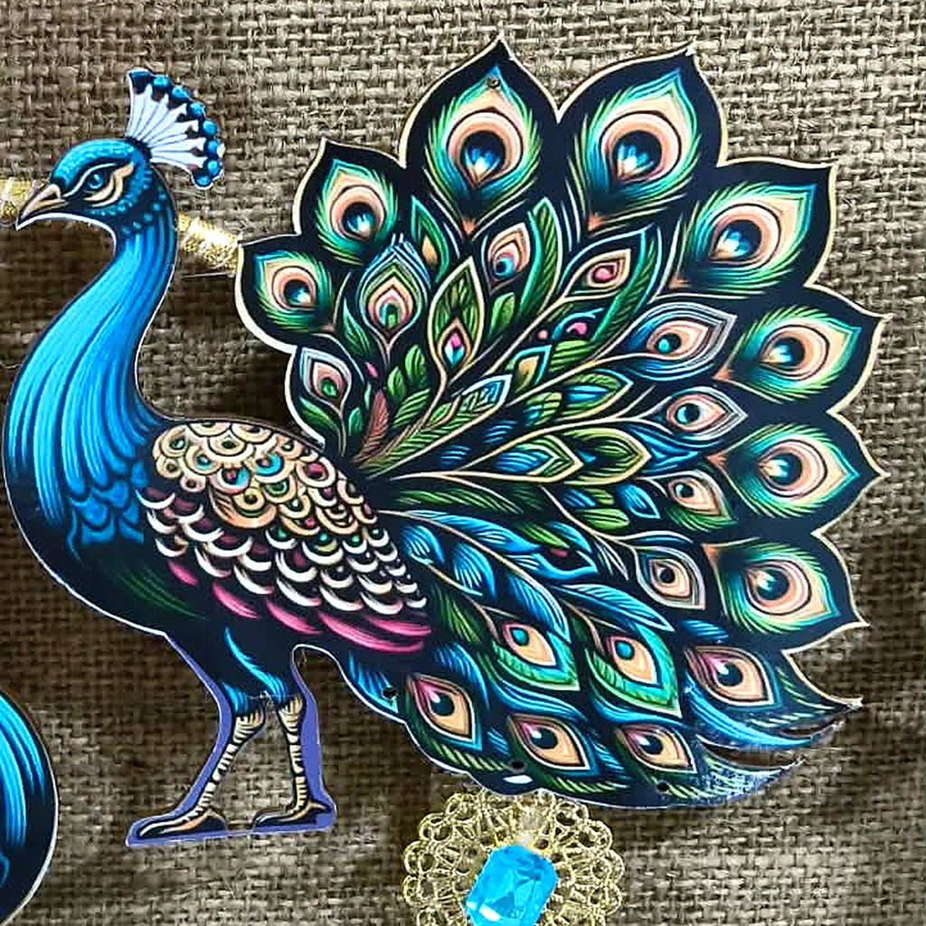 Close-up of printed peacock with turquoise stones set in golden filigree