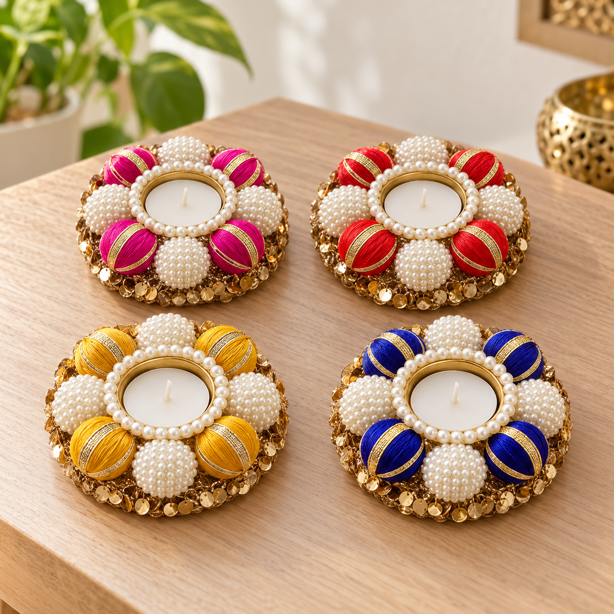 Set of four pearl and gold tea-light holders - table