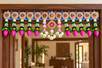 Pink lotus bud Shubh Labh toran on a wooden doorway