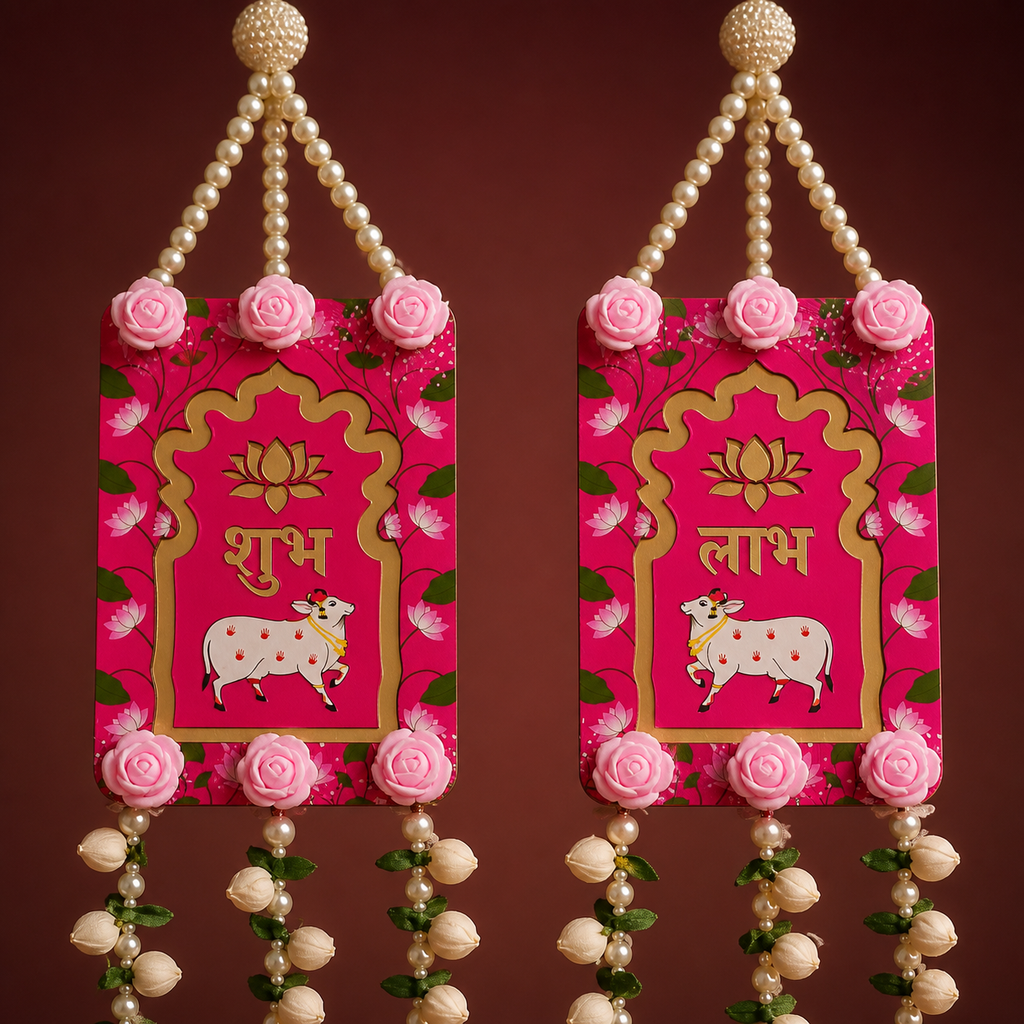 Close-up of pink Shubh Labh panels with lotus and cow motifs