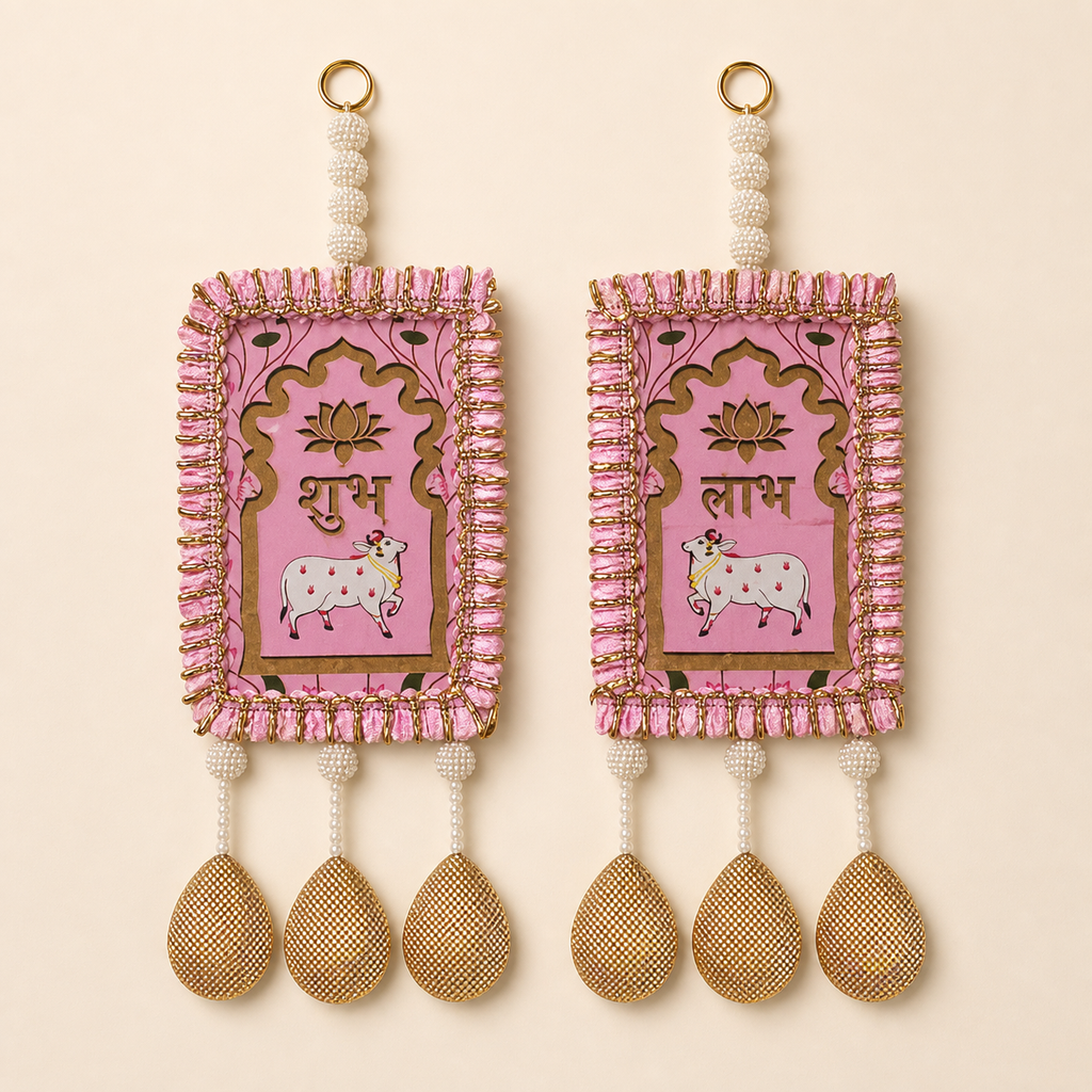 Full pair of pink Shubh Labh door hangings with cow and lotus motifs, pearl beads and golden drops