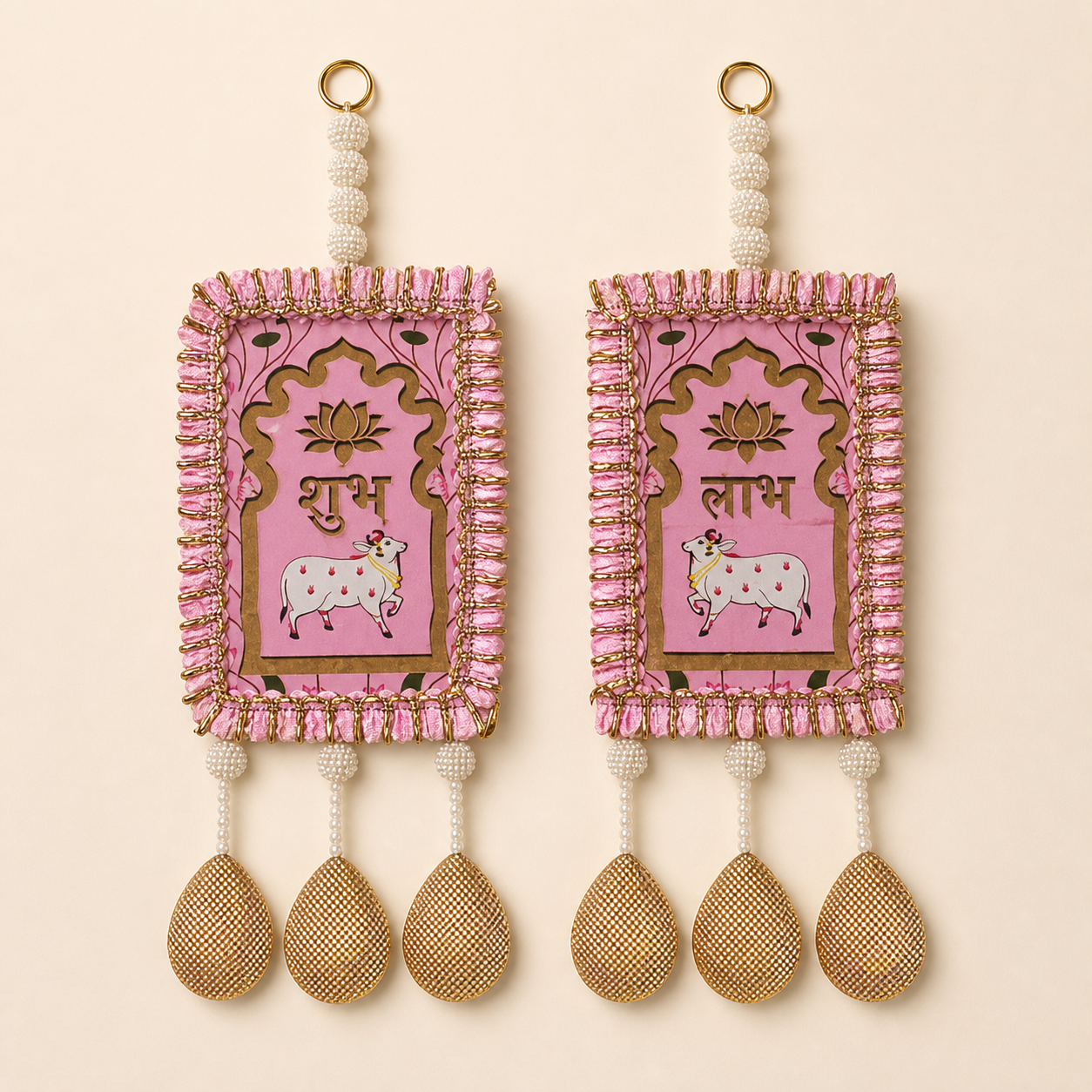 Full pair of pink Shubh Labh door hangings with cow and lotus motifs, pearl beads and golden drops