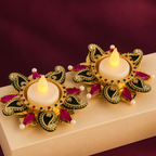 Purple stone tea-light holder pair lit on pedestal