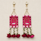 Full view of the red Shubh Labh rose door hanging pair on a neutral background