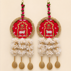 Full pair of round red Shubh Labh door hangings with white flowers, pearl beads and gold drops