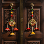 Shubh Labh silk jhumka hanging pair displayed on a carved wooden entrance door
